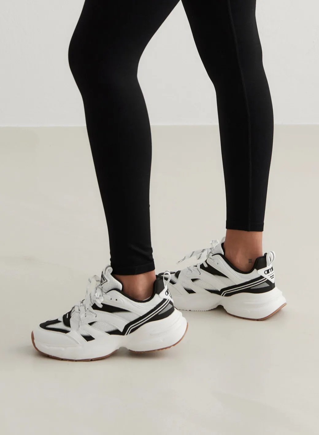 Black/white Athena 100>AIM’N Clearance